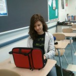 Senior Dezire Diaz uses her 1:1 laptop during homeroom to work on her Open Campus course.