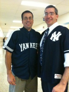 Gary Luft putting on a fake smile after his lossed bet with fellow teacher, Sean McKnight