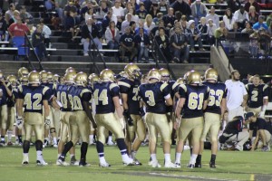 Penn Manor huddling before a play during the game against Hempfield. 