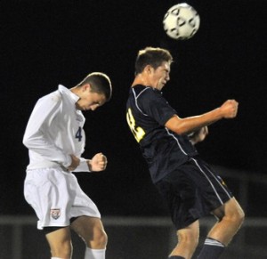 Senior Ben Jennings goes for a header in a match against Conestoga Valley. 