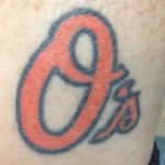 Ms. Mayo's ankle with an Orioles logo. 