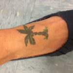 Mrs. Kroesen has a palm tree with her kids' initials tattooed on her foot.